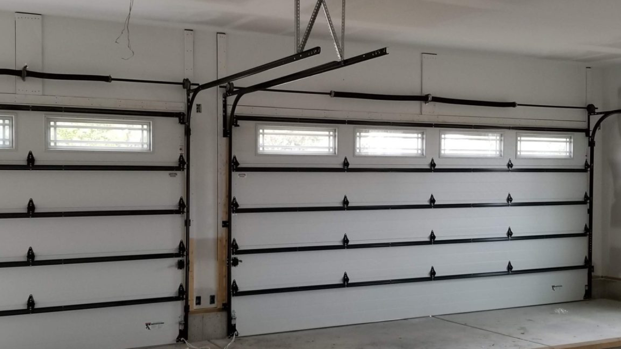 Application of Vertical and Horizontal Tracks in a Sectional Garage Door